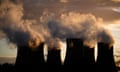 steam billows from the four Drax cooling towers at dusk in Selby, North Yorkshire