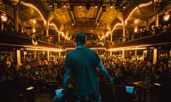 Andriy Khlyvnyuk on stage in an ornate Parisian theatre