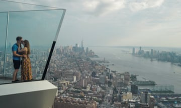 A couple kiss on the Edge at Hudson Yards observation deck