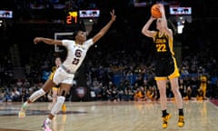 Iowa guard Caitlin Clark (22) shoots over South Carolina guard Bree Hall (23) during the first half of the Final Four college basketball championship game in the women's NCAA Tournament, Sunday, April 7, 2024, in Cleveland. (AP Photo/Carolyn Kaster)