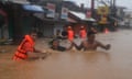 Storm unleashes torrential rain and strong winds that have claimed at least three lives and forced authorities to shut schools and offices