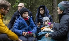 The Massini family from Syria, father Muhammad (second left), mother Alaa (centre) and their two sons, with activists