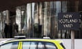 Police car parked outside New Scotland Yard.