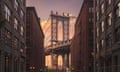 Manhattan Bridge, NYC<br>Manhattan bridge seen from a brick buildings in Brooklyn street in perspective, New York, USA. Shot in the evening