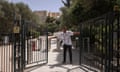 Heatwave hits Greece<br>An employee shuts the exit door of the Acropolis hill archaeological site as it temporarily closes due to a heatwave hitting Athens, Greece, June 12, 2024. REUTERS/Stelios Misinas