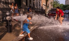 Children play next to a fire hydrant