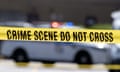 Yellow crime tape blocks off an area near a mall parking area where two Baltimore city police officers were shot and a suspect was killed as a U.S. Marshals’ task force served a warrant, Tuesday, July 13, 2021, in Baltimore, Md. The police officers were taken to the University of Maryland Medical Center with injuries that aren’t thought to be life-threatening, county police spokeswoman Joy Stewart said.( (AP Photo/Jose Luis Magana)