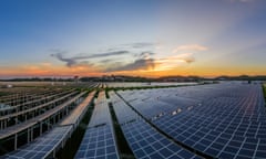 a solar power plant at sunset