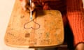 Student drawing a heart on her desk