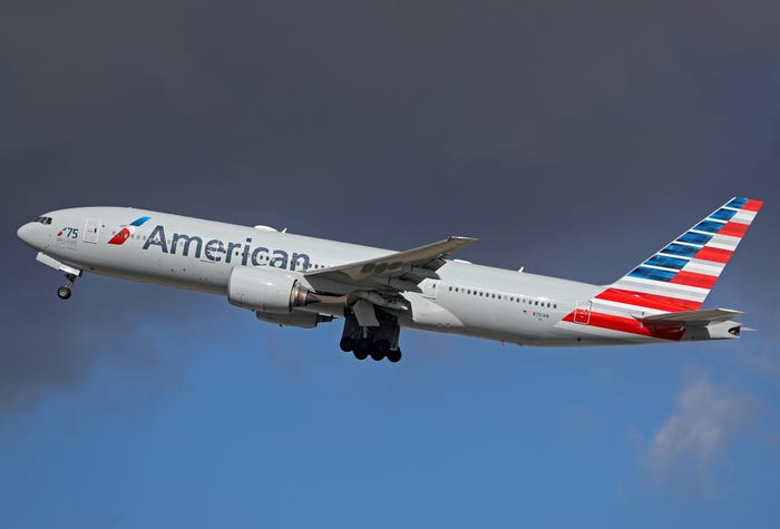 An American Airlines Boeing 777 plane taking off.