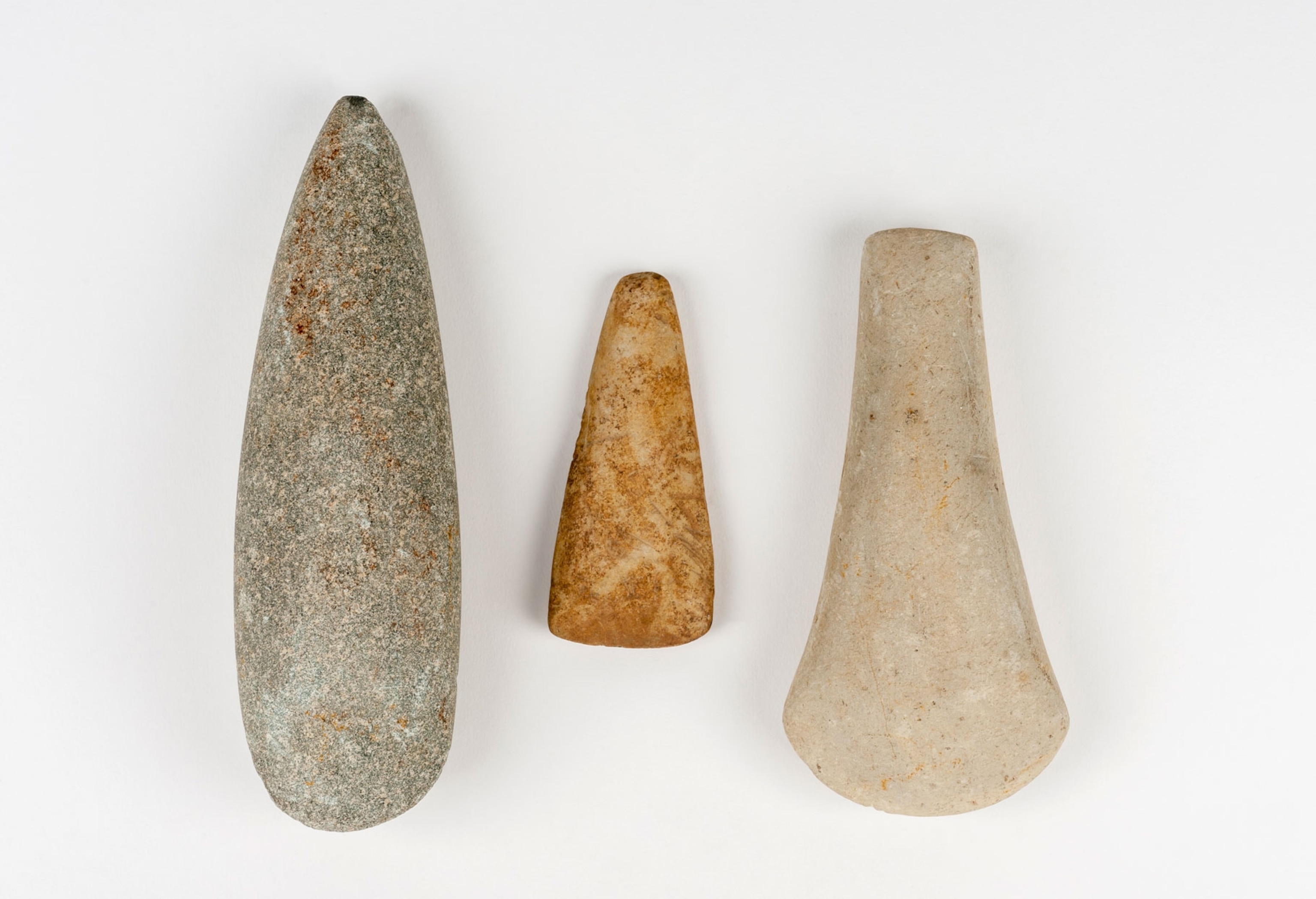 Three smooth pointed stones