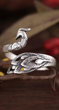 A beautiful ring featuring a beautiful bird! The peacock is known for its gorgeous plumage and now we have a ring to reflect that! The elegant, adjustable design is perfect for any finger and bring some of this bird's majesty to your jewelry collection