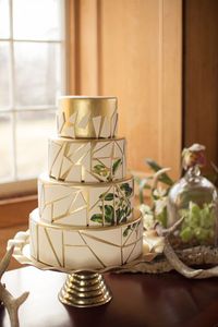 Thoughts on this vintage cake? We love the intricate design. Leave your comments below. We'd love to hear what you think. . . #vintage #weddingcake #gold #floral #reception #desserttable #geometric #simple #elegant #beautiful #golden #2017 #bride #wedding