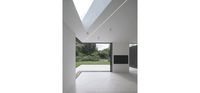 Open corner of sliding glass doors and shaped glass rooflight