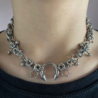 chainmaille chunky choker necklace with a variety of piercings and metal beads. The piercing jewellery on this is real, so please make sure the ends are properly screwed on before wearing it. Message me for any questions or changes. Stainless steel / tarnish free / hypoallergenic 14 inches + 5cm extender