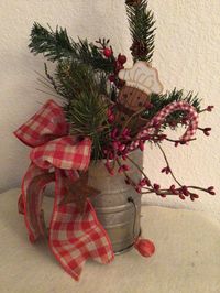 "This is for one metal faux vintage tin sifter gingerbread Christmas decor Faux age painted, antiqued and distressed it is decorated with Christmas greenery, a wooden gingerbread ornament, a fabric candy cane and a red gingham bow. Overall Size: 12\" x 5\" Check out my other Etsy Shops: https://www.etsy.com/shop/oldporchsigns https://www.etsy.com/oldvintageporch Most of my signs, crafts and home decor items are made and ready to ship. Special and multiple orders can be made and shipped within 2