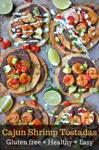 These easy Cajun Shrimp Tostadas are full of zesty shrimp, refried black beans, fresh veggies and a delicious jalapeño ranch sauce! Ready in just 30 minutes and perfect for busy weeknights!