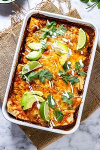 These easy vegetarian enchiladas are stuffed with a mixture of vegetables, quinoa and beans then topped with a spicy enchilada sauce and plenty of cheese! #thecookreport #enchiladas #vegetarianenchiladas #mexicanfood #enchiladarecipe