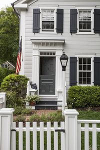 Creative Ways to Use Leftover Paint: Give your home an easy dose of curb appeal with a refreshed front door and window shutters.