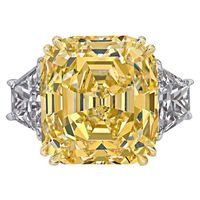 GIA Certified 14.36 Carat Fancy Intense Yellow Emerald Cut Diamond Ring | From a unique collection of vintage engagement rings at https://www.1stdibs.com/jewelry/rings/engagement-rings/