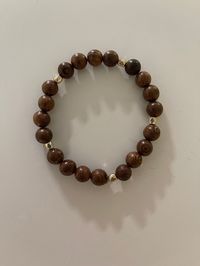 "This Stretchable Bracelet can be for Men or Women.  It is handmade with dark brown 8mm Natural wood beads and Gold spacers.  It looks very appealing on the wrist.  This is size 7.5\" but it can be ordered in different sizes. It would make a great gift for any occasion."