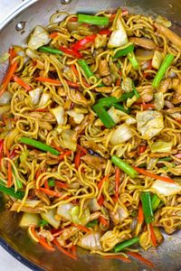 The noodle stir fry in a skillet.