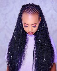 13. Knotless Wavy Cornrow: Achieve a sleek and natural look with braids that start closer to the scalp, adorned with silver accessories