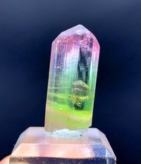 Natural Bicolor Tourmaline Crystal from Paprok Afghanistan Crystal is terminated and damage free. Crystal have good color and luster. Weight : 25.65 carat Size : 29*13*08 mm Origin : Paprok Afghanistan Treatment : None Economy Shipping. TRG7-25