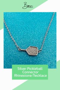 Shine with every serve! This stunning silver pickleball connector necklace with rhinestones is perfect for enthusiasts. Click to add some sparkle to your style! 💖#borntorally #pickleballlove #sportyjewelry #pickleballnecklace #athleticfashion #jewelryforathletes #sportsaccessories #pickleballplayers #gameon