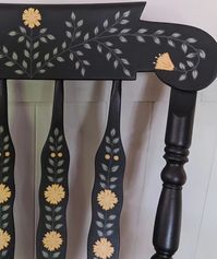 Large, solid wood, and super sturdy rocking chair. This is a repaint of my first rocking chair since I've decided to keep the last wooden one for now! The base color is a charcoal that appears more like dark blue in bright lighting. Lots of hand painted leaves, yellow flowers, and little gold details. 🌼 #handpaintedfurniture #handpaintedchair #handpaintedrockingchair #vintagerockingchair #rockingchair #accentchair #nurserydecor #nurserychair #fusionmineralpaint #colorfulhome #interiordesign ...