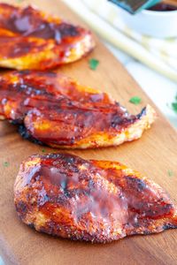 Chicken breasts on cutting board. 