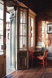 cute antique cafe with red chairs and old windows and brick and gosh its so cute