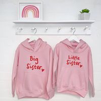 This is the cutest Sisters matching hoodies set.....perfect for twin sisters or a big sister and little sister. This is bang up to date with a cool red print on pale pink jumper. Sisters will love to be matching and this makes it a perfect gift for any sisters.  80% Ringspun Cotton, 20% Polyester. Machine Wash at 30 degrees. Can be tumble dried but better if dried naturally. Iron inside out to avoid print.