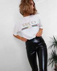 Tuck it into leather bottoms. #refinery29 http://www.refinery29.com/2016/12/134182/gucci-logo-t-shirt-trend#slide-2