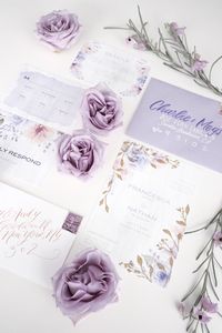 If you're thinking of being on trend and using shades of pretty purple in your wedding day palette, we are breaking down how to flawlessly design your invitation suites to set the tone!�