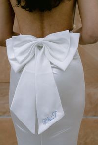 On par for the 2024 and 2025 brides! Bows are the IT accessory so what better way to add it it any and every bridal outfit you have! This double bow will surely be the center of attention. Easily pin it to a dress or bikini for your bachelorette. Personalization is beautifully embroidered for that lasting touch.