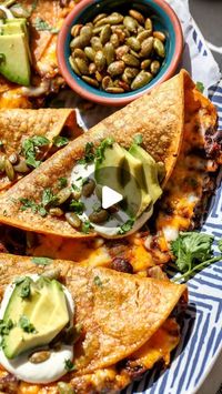 Jamie Vespa MS, RD on Instagram: "Add some seasonal spice to your taco night with these weeknight-friendly Crispy Chipotle Pumpkin Black Bean Tacos. Filled with warming, smoky spice and topped with creamy, crunchy fixings, they’re a delicious, nutrient-packed vegetarian taco.

Here’s what you need:
▢ extra-virgin olive oil
▢ chopped yellow onion
▢ garlic cloves, minced
▢ tomato paste
▢ chipotle peppers in adobo sauce
▢ chili powder
▢ ground cumin
▢ ground cinnamon
▢ canned black beans
▢ canned pumpkin puree
▢ grated Colby Jack cheese (sub white cheddar or Gouda)
▢ corn tortillas
▢ sour cream or plain full-fat Greek yogurt
▢ Optional garnishes: sliced avocado, chopped fresh cilantro, and/or toasted, salted pumpkin seeds

For the FULL recipe, either click the link in my bio or comment “Taco 