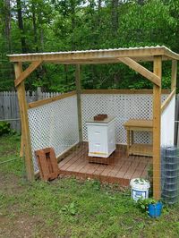 The beautiful Bee Hut and work table that my Hubs built for me.