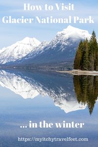 Text: How to visit Glacier National Park in the winter. Photo: Snow-capped mountains reflected in the blue water of Lake McDonald.