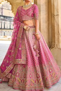 Bridal lehenga. Heavy embroidery and stone work. LEHENGA FABRIC: Heavy Fabric BLOUSE FABRIC: Heavy Fabric DUPATTA: Pure Net COLOR: Pink Bonus offer - Receive a free mystery gift with your order. Stitching Option - We will email you the measurement guide to confirm your size. SHIPPING: The product will be shipped within 1 - 2 weeks from the date of purchase. Product is returnable if un-Stitched This product qualifies for free shipping For any Rush/Urgent orders please email us at customercare@des