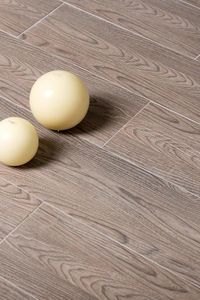 The Ariel wood effect tiles are a warm chocolate tone with a strong wood grain adding depth and warmth to the room.