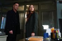 Teen Wolf: The Movie (2023). Jackson Whittemore (Colton Haynes) & Lydia Martin (Holland Roden). This is a behind-the-scenes still photograph from the movie. Lydia and Jackson are inside the completely empty police station office. Lydia: “Someone was killed here.” Jackson: “Yeah, I’m pretty sure a lot of people have been killed here, Lydia.” Lydia: “Recently.” Jackson: “Wait. Are – are we gonna be killed here?”