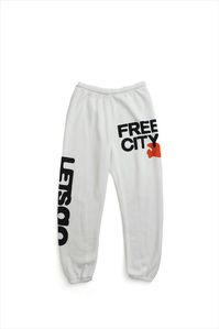 Unisex sweatpant with classic "Free City" print in black and yellow. A supersoft essential sweatpant with a covered elastic waist and a pull drawstring. WHY WE LOVE IT FREECITY, born in 2001, uses local factories with custom developed materials, fabrications, washes and dyes. Prints are hand-thrown, using hand-mixed paint with on-screen mixed gradients - made one by one, in small batches. DETAILS Medium weight polyblend: 50% rayon, 25% polyester, 25% cotton. Hand-sewn, washed, and hand-screen pr