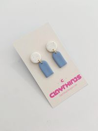 Lightweight. Durable. Bold. Hypoallergenic Polymer Clay Earrings Made to Standout. The Details: Mini Clay Earrings, with a lovely trendy feel.  Colours: CTS White Speckle and Light Blue Findings: Gold Plated, Non Tarnish Posts: Stainless Steel, Hypoallergenic  Length: 1.25 Inch Our Posts are secured with a strong hold, using Liquid Clay, and baked on. Please allow 1-3 Business Days for your order to ship out. Shipping from Winnipeg, MB. May arrive within 5-8 Business days.  Thank you for your su