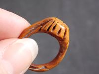 The poor mans wedding ring... But so charming that you dont mind! This is a really neat hand carved peach pit ring. It is well made and has a