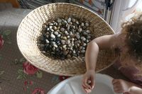 Toddler heuristic play with pebbles