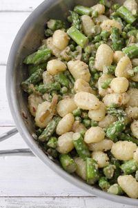 Spring Vegetable Gnocchi! Peas and asparagus in a light cream sauce and gnocchi. Vegetarian | www.delishknowledge.com