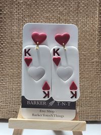 Pre Order King of Hearts polymer clay earrings. White with red clay. Stainless steel post. These are available for Pre-order. Please allow 1-3 days for them to be made and 1-2 day shipping time. Message for questions.