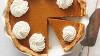 When it comes to Thanksgiving, our eyes go right to the dessert table, searching for homemade Pumpkin Pie. With a flaky crust, smooth pumpkin filling and sweetened whipped cream, what's not to love about Pumpkin Pie? This is the best Pumpkin Pie recipe we've ever made, thanks to its incredible flavor profile and simple instructions. If there are leftovers–which are usually hard to come by–we'll even have Pumpkin Pie for breakfast!