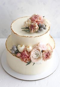 32 Jaw-Dropping Pretty Wedding Cake Ideas - Two tier white wedding cake adorned with flowers #weddingcake #cake #seminakedweddingcake